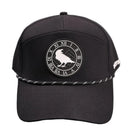 Black cap with a circular emblem featuring a bird and Roman numerals on a gray background